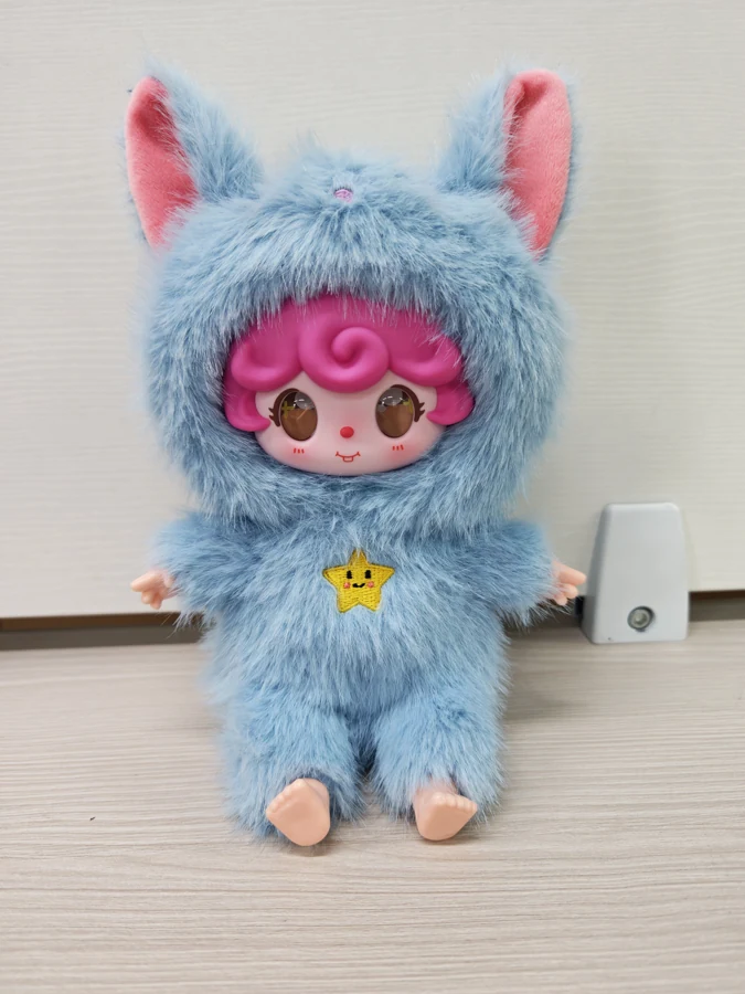 Seated AI character — blue pointed ears