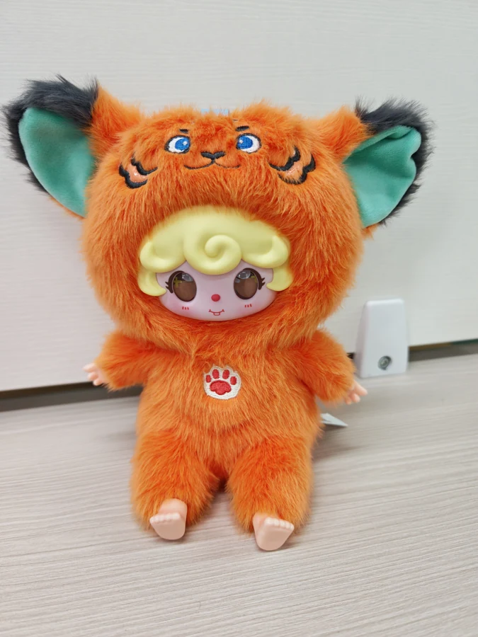 Seated AI character — orange creature