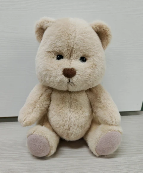 Jointed seated teddy bear