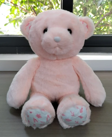 Seated teddy bear — pink
